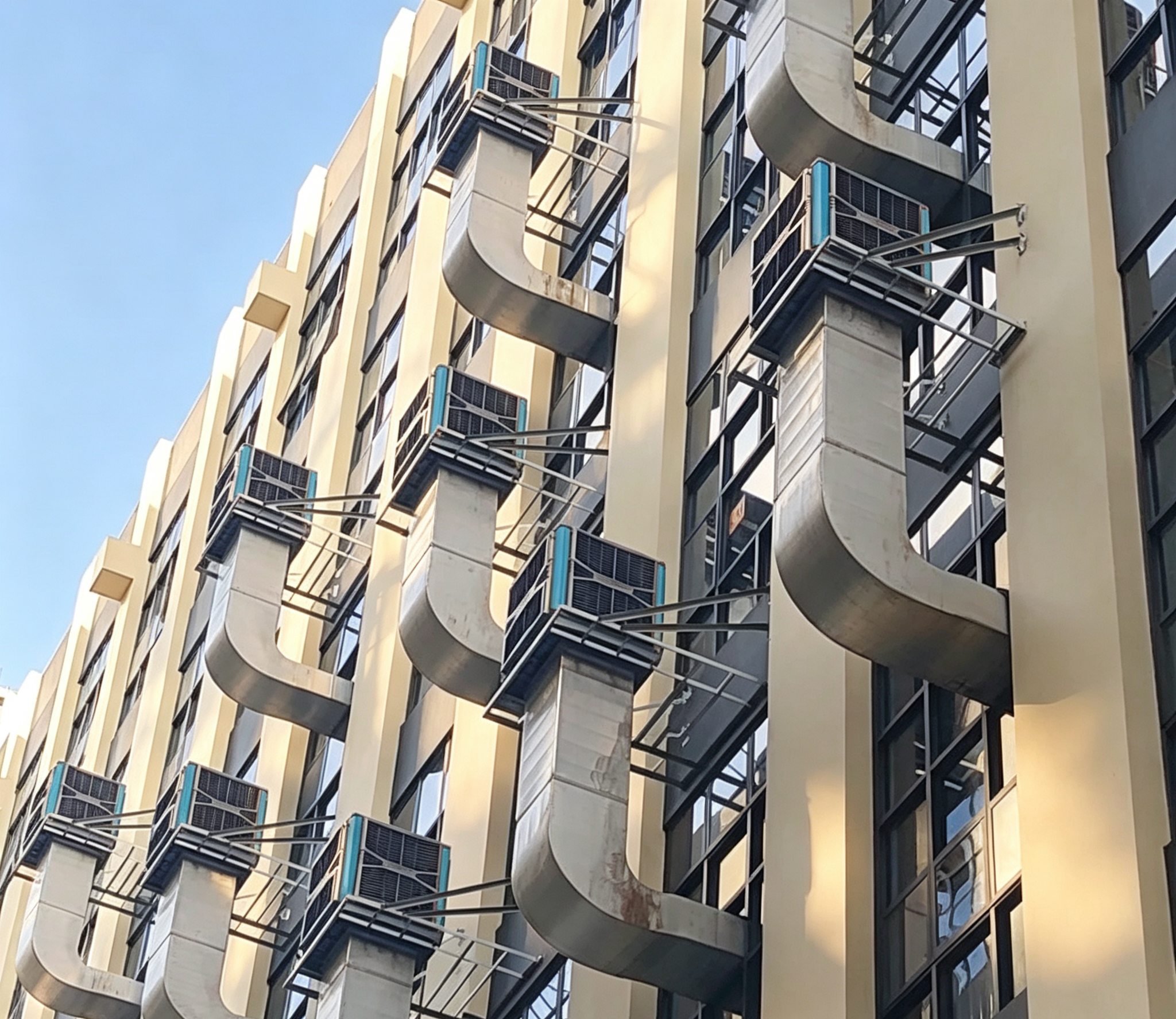 Ducted Hantai evaporative air cooler installation on a building wall